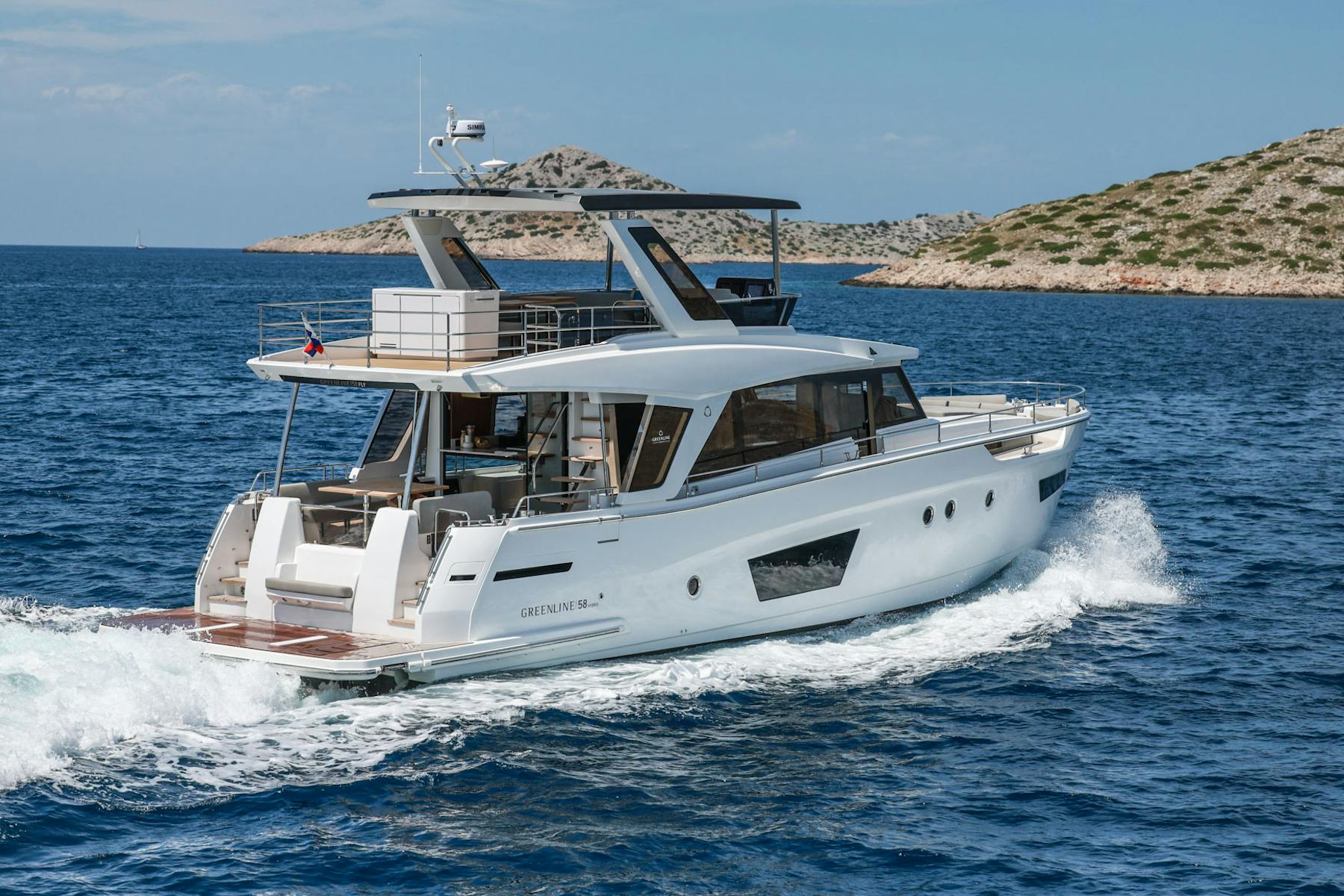 Greenline 58 Fly underway beside a rocky coastline