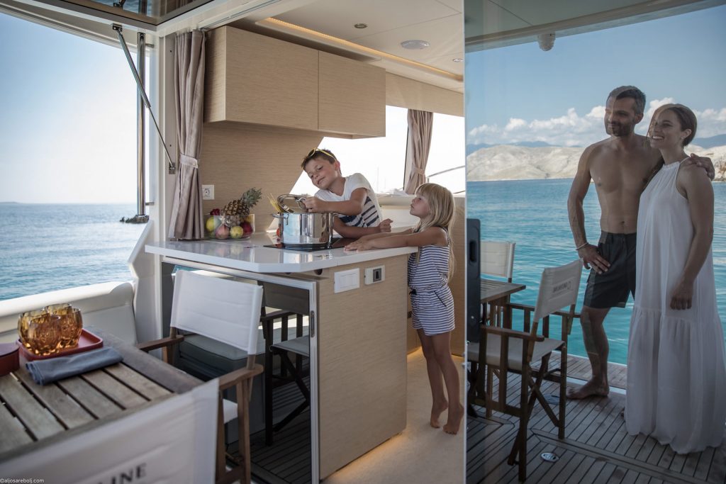 People aboard the Greenline 39 beside the aft galley and cockpit